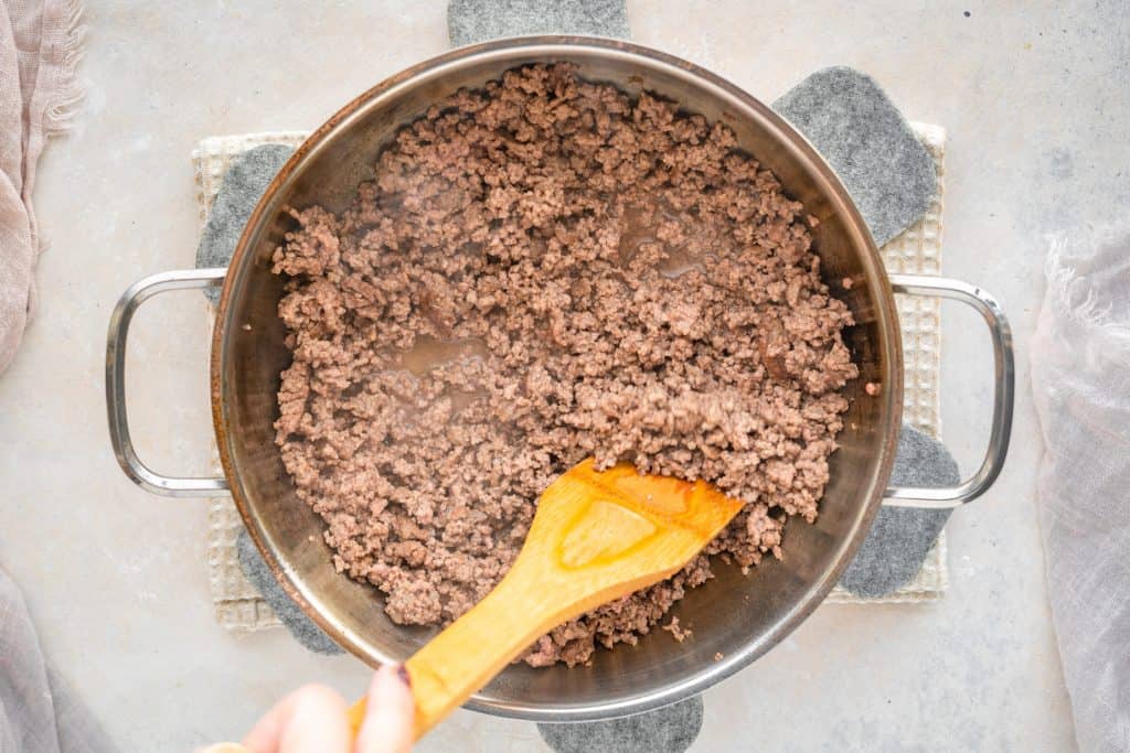 Philly cheesesteak casserole Beef inside of a pan cooking