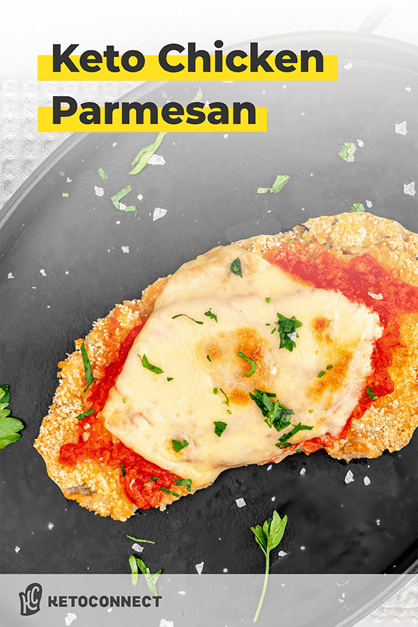 keto chicken parmesan on a black plate with garnish