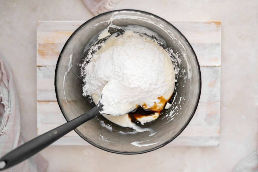 Keto Cheesecake Fat Bombs adding sweetener into the cheesecake batter