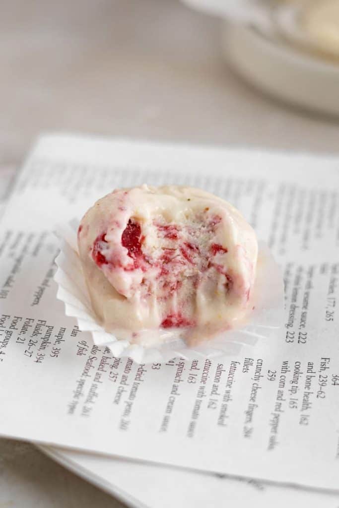 Keto Cheesecake Fat Bombs A cheesecake fat bomb on newspaper