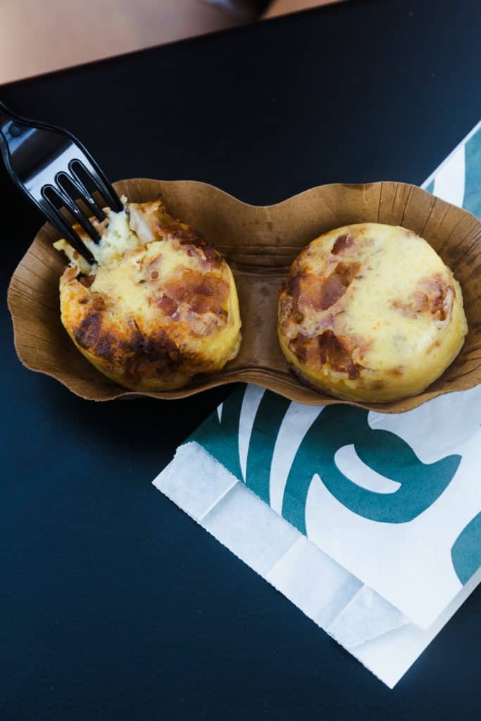 sous vide egg bites in container with starbucks bag underneath