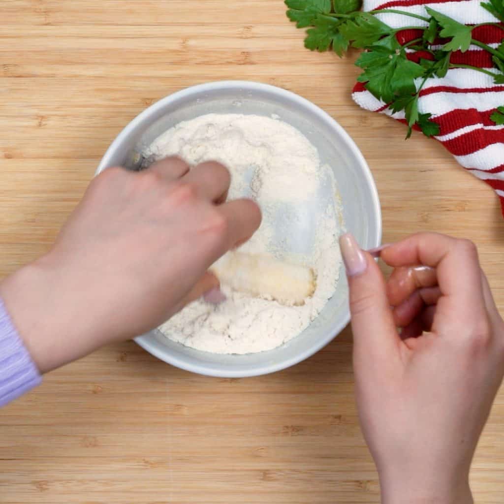 next the sting cheese is dipped in coconut flour