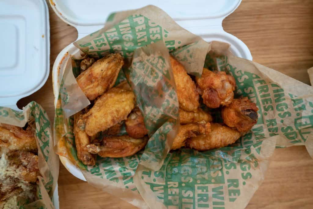 box of chicken wings from wingstop with multiple flavors