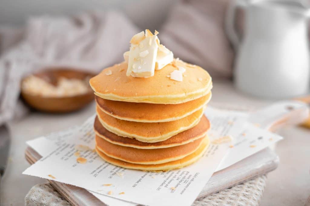 Six protein pancakes atop a cutting board