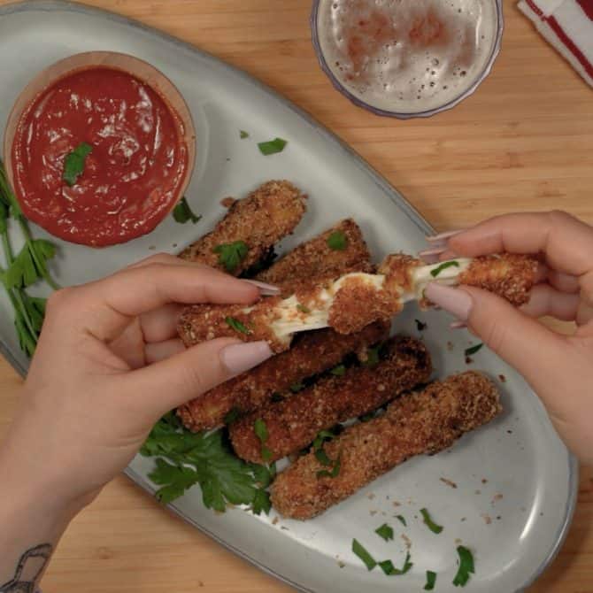 keto mozzarella sticks being pulled apart