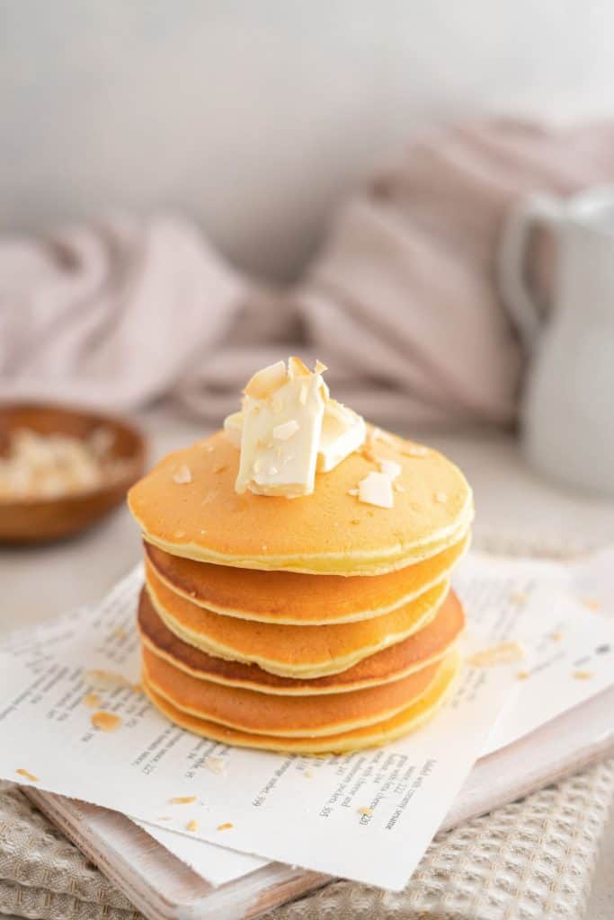 fluffy pancakes stacked with butter