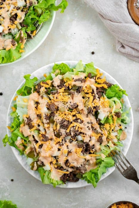 A close up shot of big mac salad in a white bowl