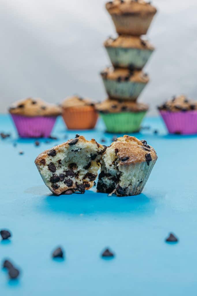 A chocolate chip muffin ripped in half for a chocolate packed center shot