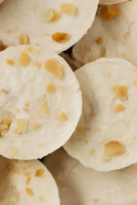 very close shot of a stack of fat bombs with macadamia nuts