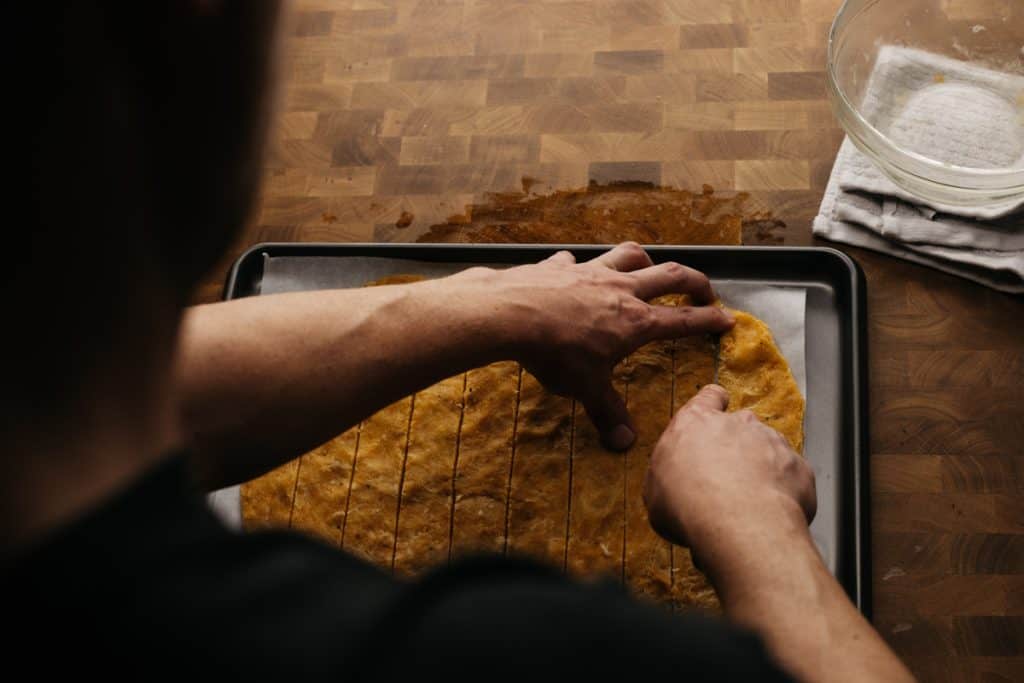 Cutting keto tortilla chips over the chefs shoulder