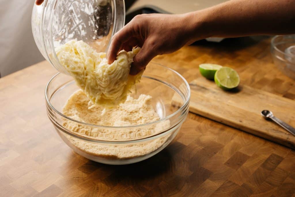 Adding melted mozzarella to the flour base