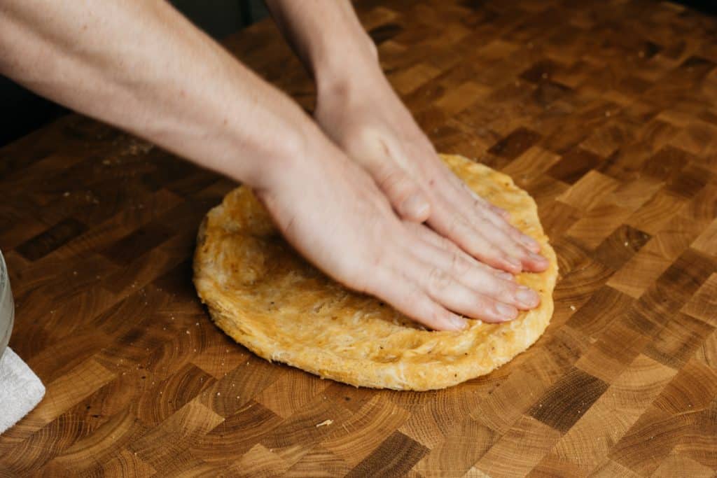 Rolling out the chip dough for tortilla chips