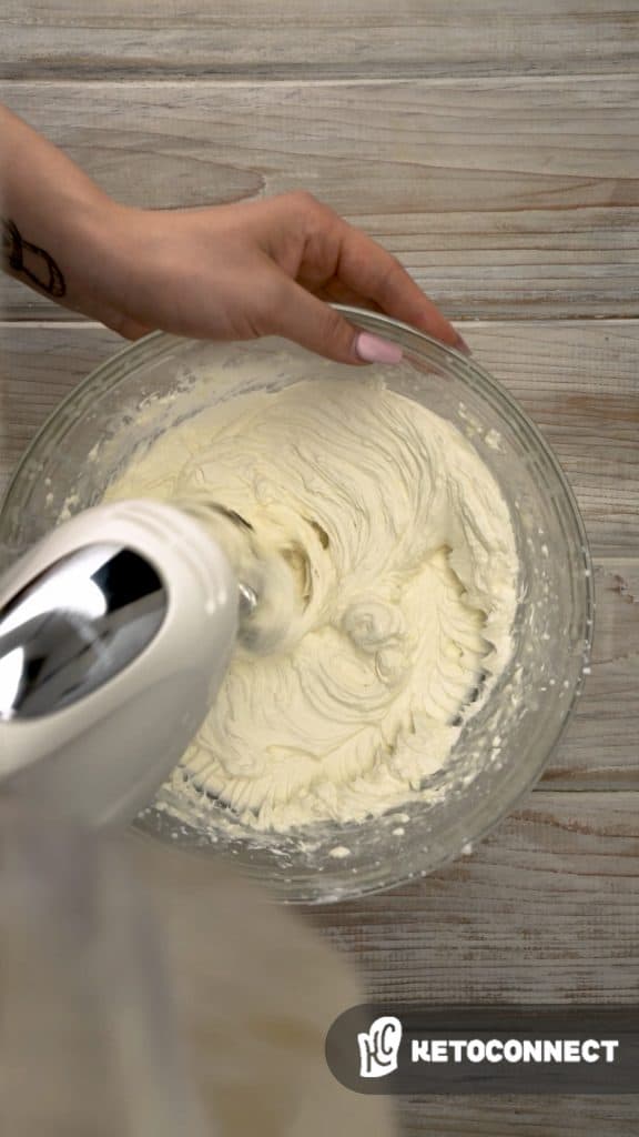 keto no bake cheesecake Mixing the filling for no bake cheesecake with a electric hand mixer