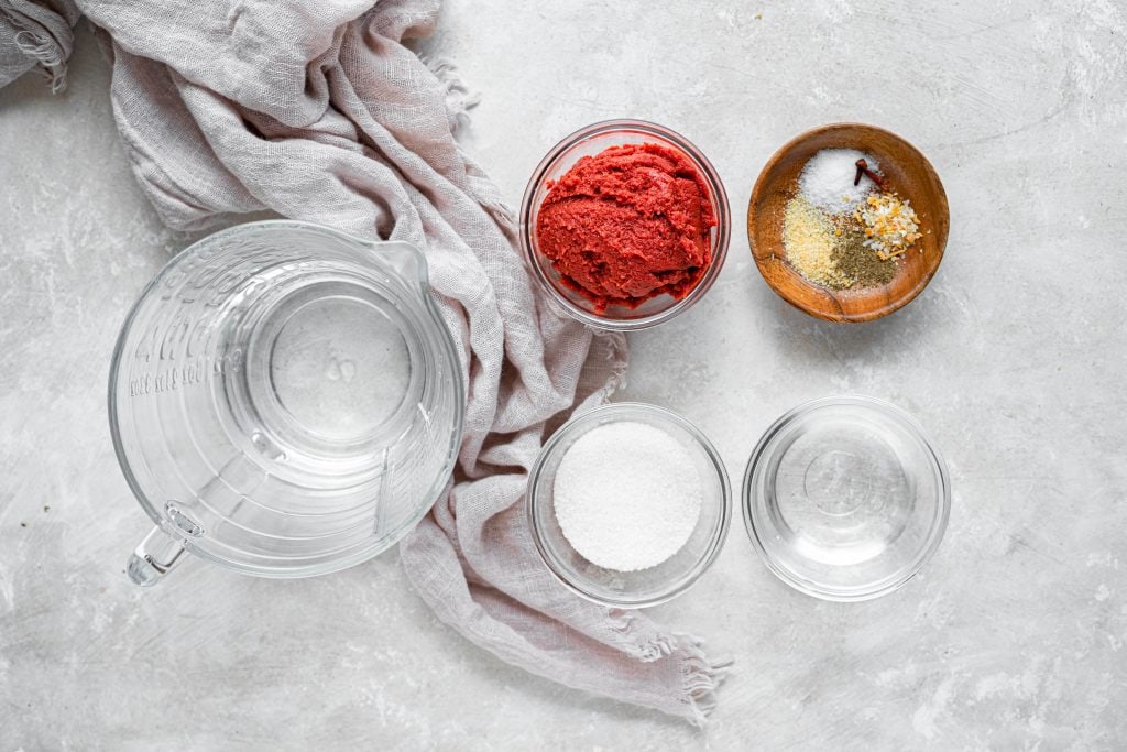 bowls filled with ingredients needed for making ketchup