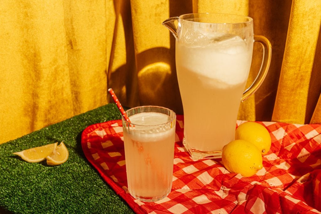 pitcher of sugar free lemonade on a picnic table