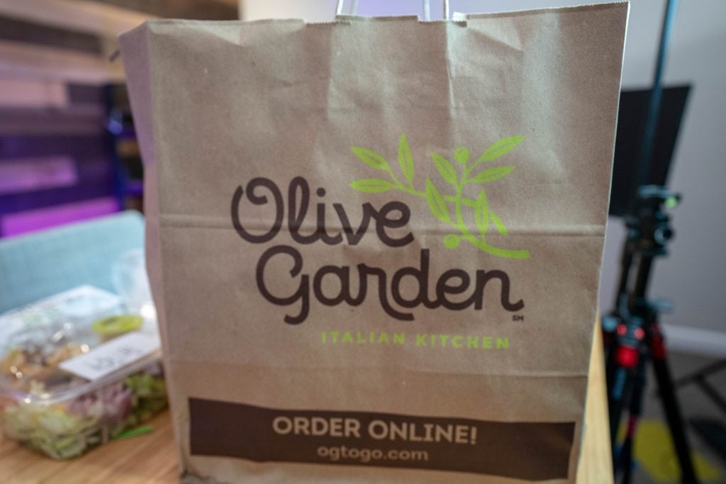 olive garden to go bag sitting on a table