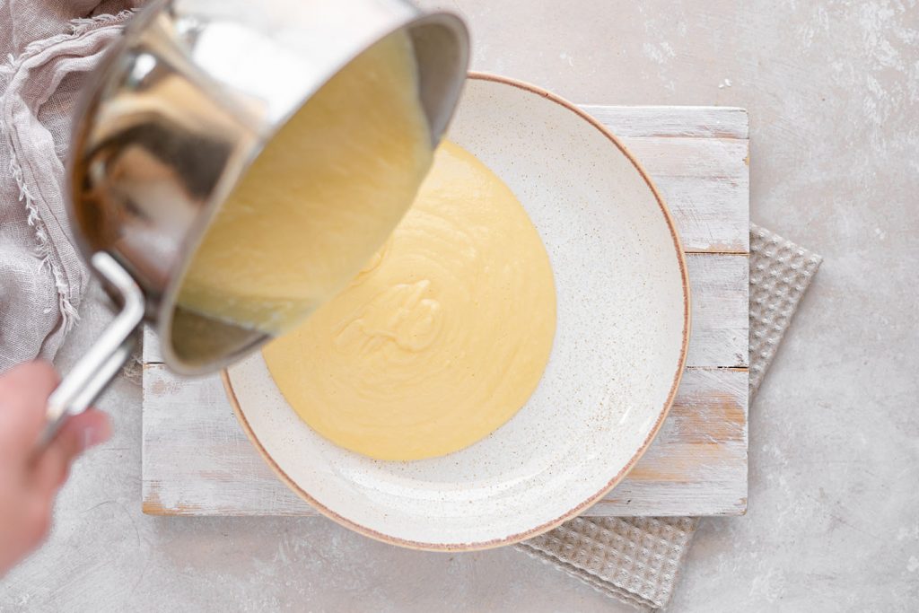almond milk ice cream ice cream mixture being transferred to a bowl