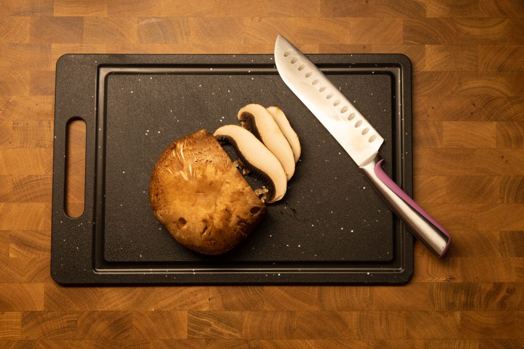 a portabella mushroom being chopped