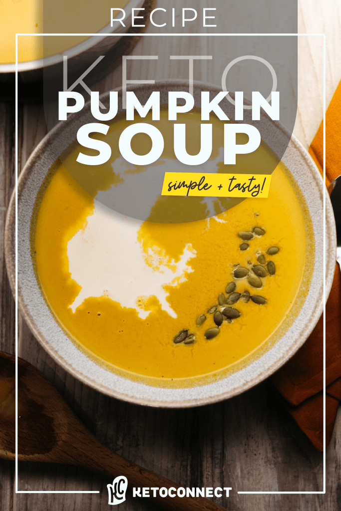 a large bowl of keto pumpkin soup with pumpkin seeds on top