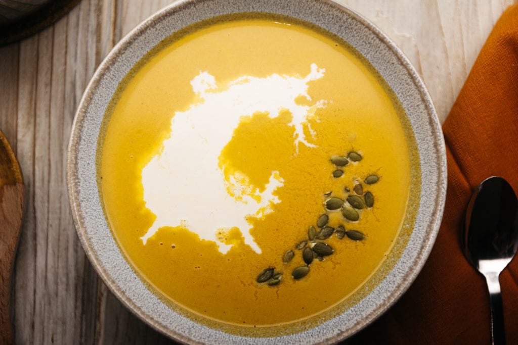 overhead shot of keto pumpkin soup in a bowl