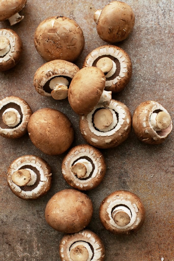 brown mushrooms laying on a table