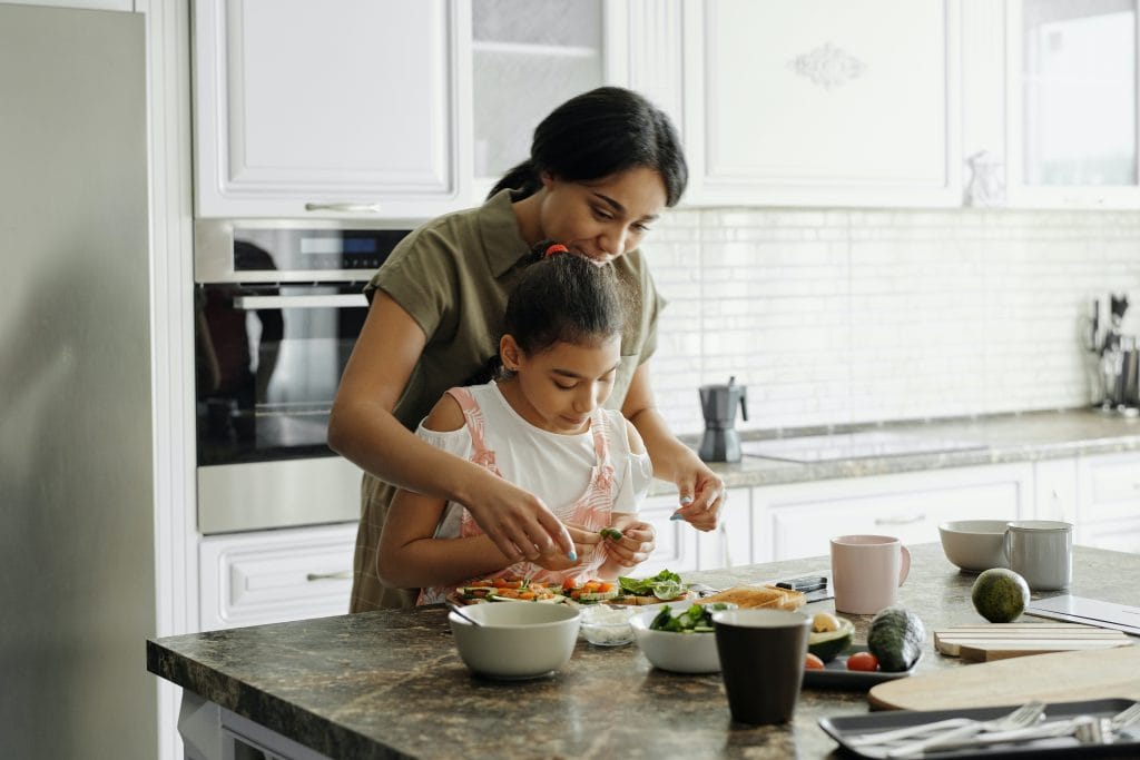 woman and daughter cooking in the kitchen