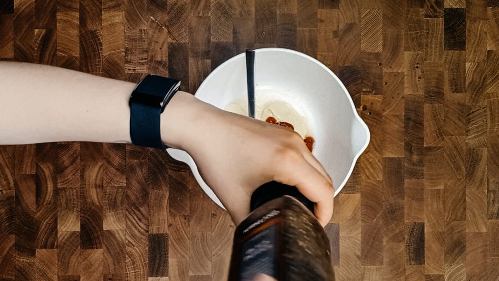 keto thousand island dressing Cracking black pepper into the thousand island dressing
