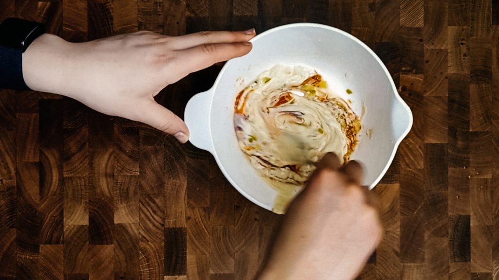 keto thousand island dressing Stirring a bowl of homemade thousand island dressing