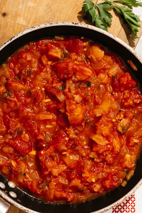 keto spaghetti sauce in a skillet on a cutting board