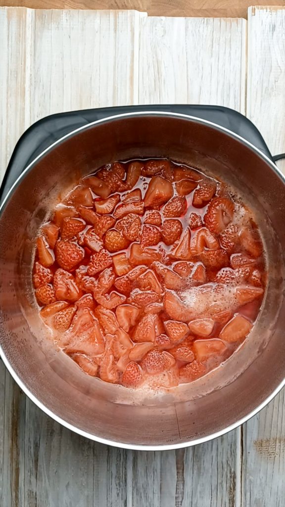 sugar free jello keto simmering strawberries in a saucepan
