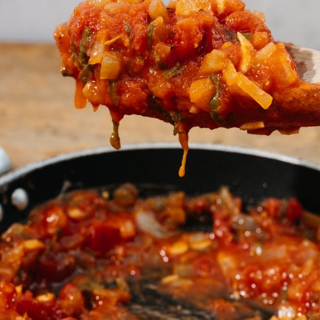keto spaghetti sauce on a wooden spoon