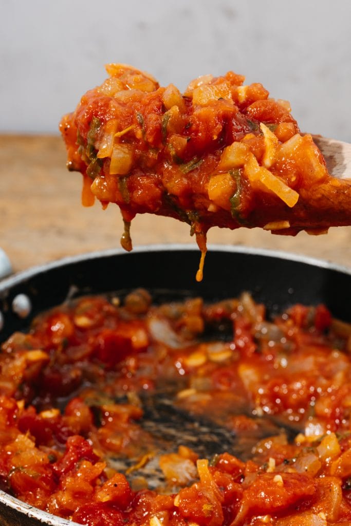 keto spaghetti sauce on a wooden spoon