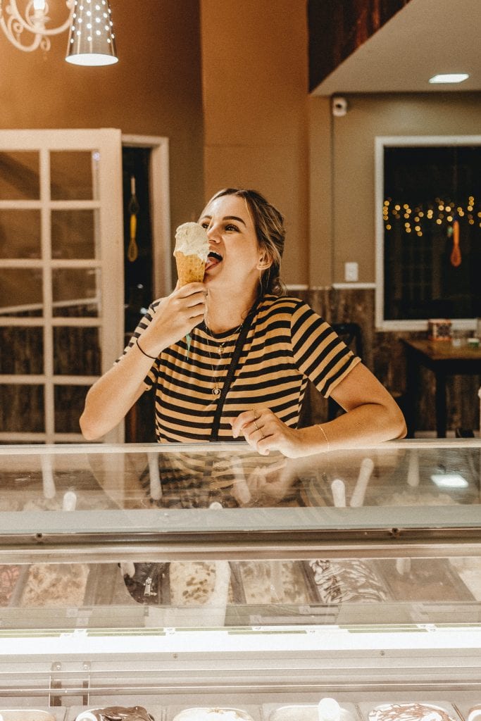 woman eating ice cream at the counter
