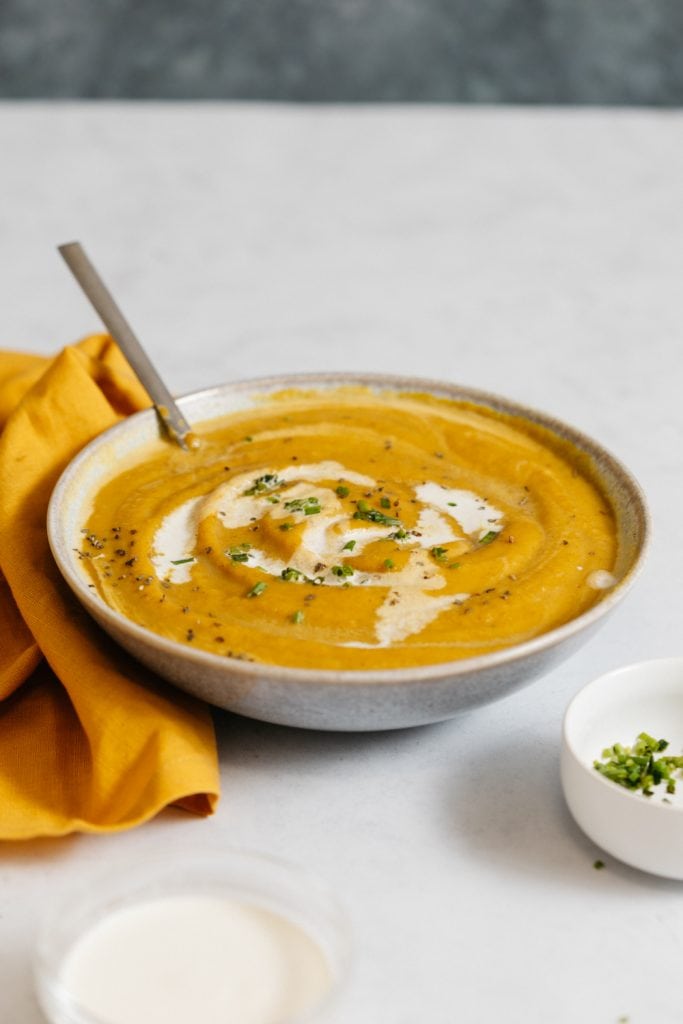 served creamy butternut squash soup on the table