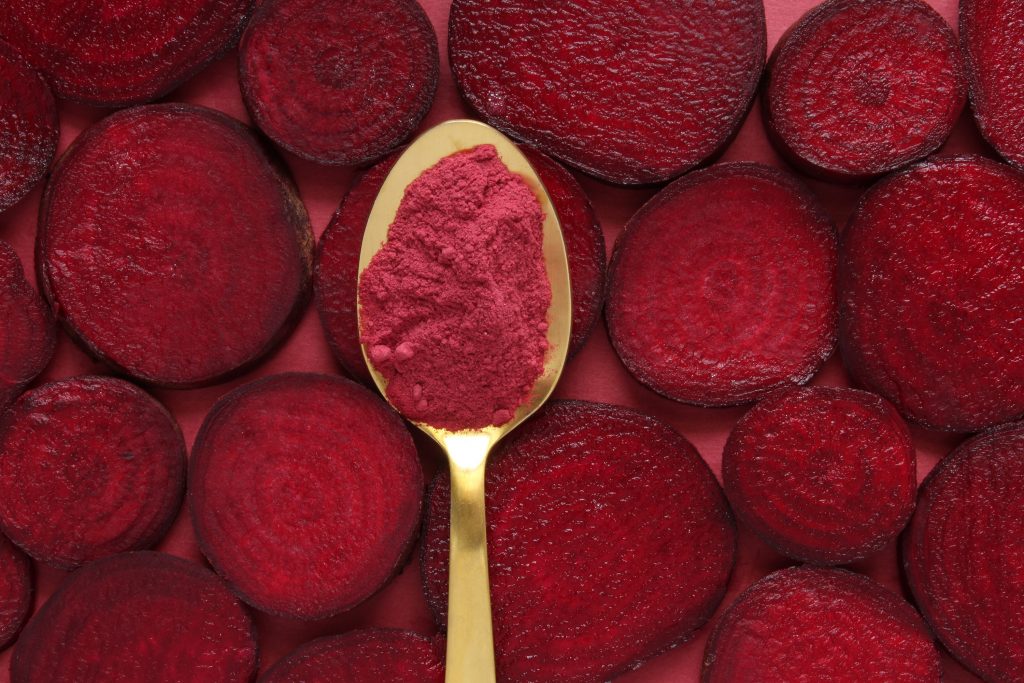 beet root powder on a spoon