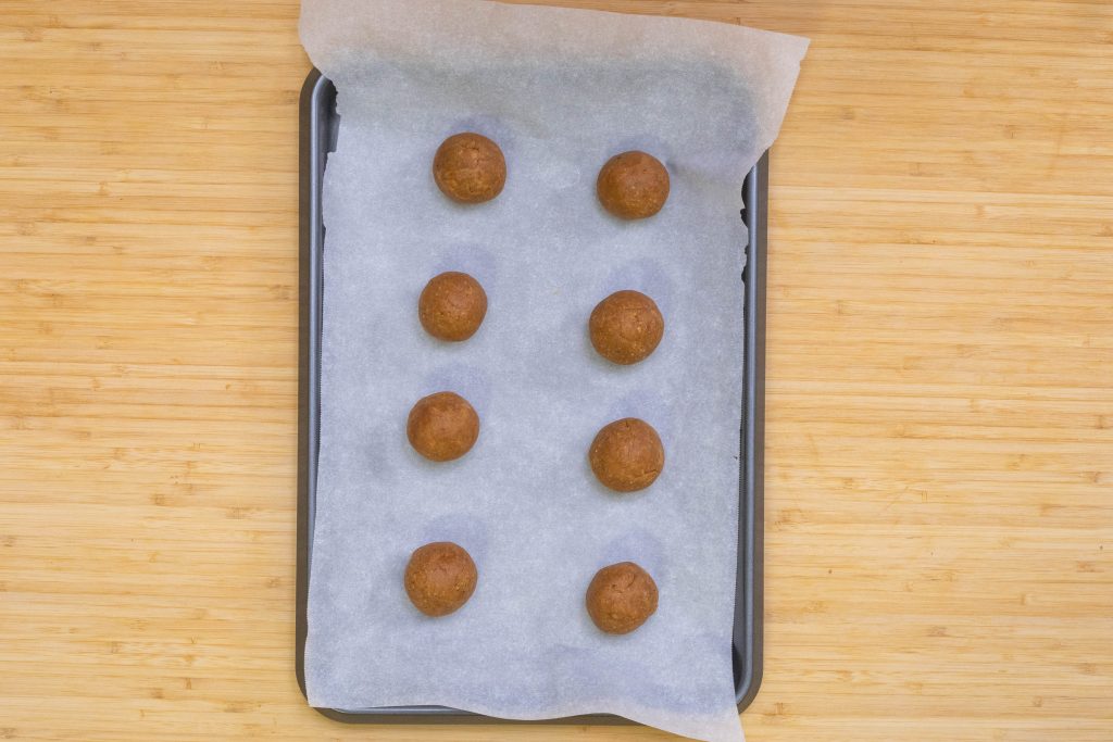 keto peanut butter balls formed peanut butter balls on the parchment paper