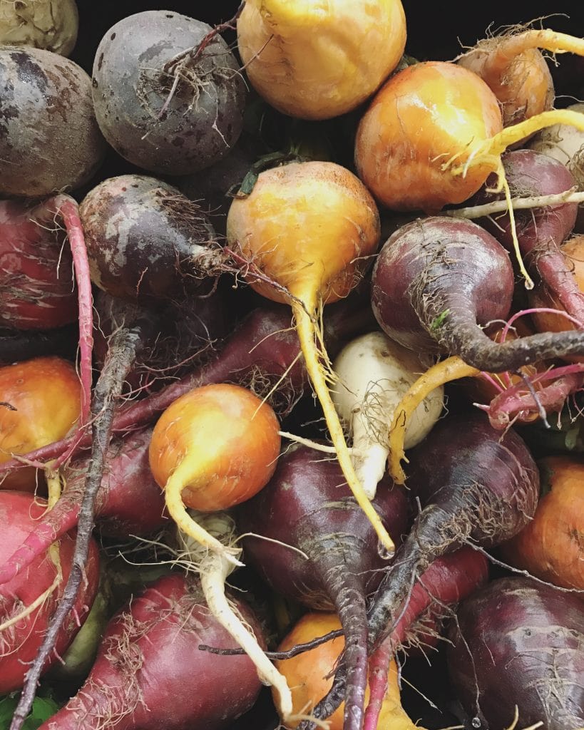 stack of multi colored beets close up