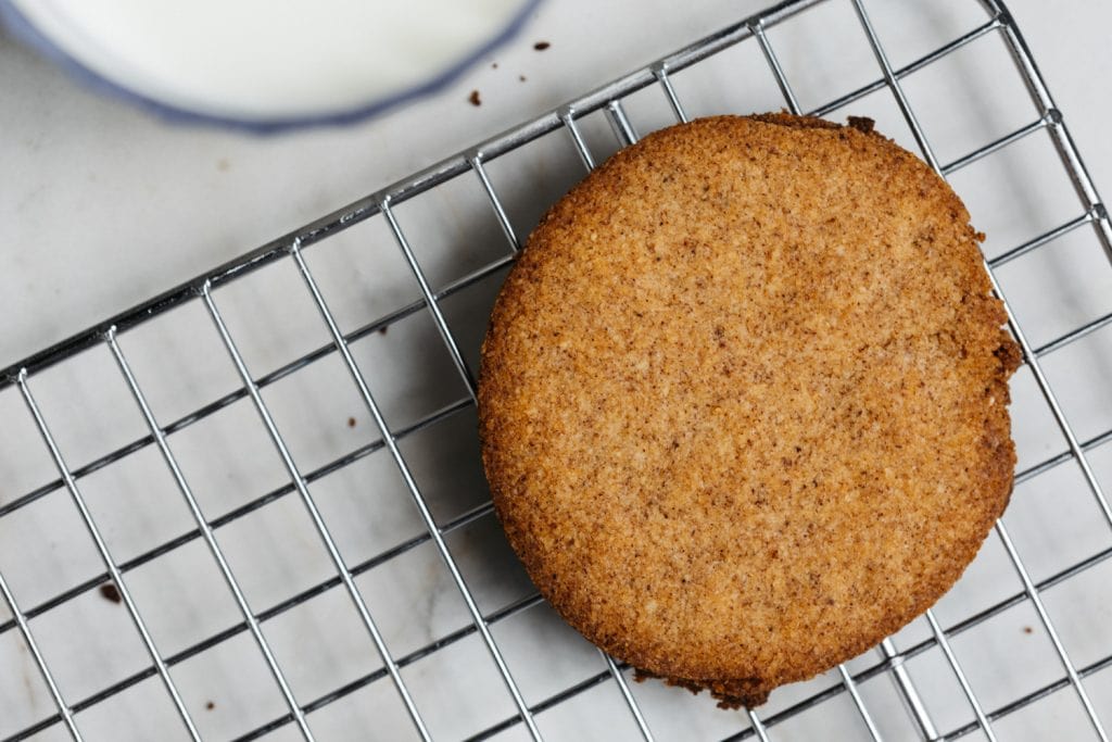 Keto Gingerbread Cookies keto gingerbread cookie on a cooling rack close up