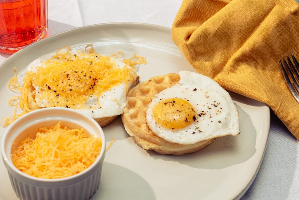 keto wonder bread chaffles served with eggs and cheddar cheese