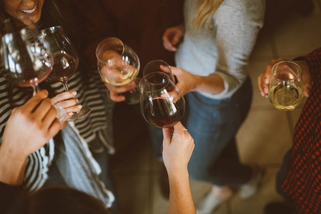 group of people drinking wine and having fun