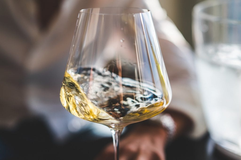 white wine spinning in a wine glass