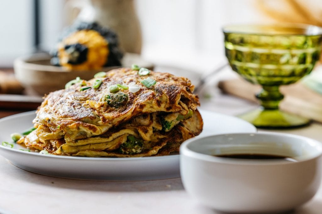 Chicken Egg Foo Pancakes served with sauce for breakfast