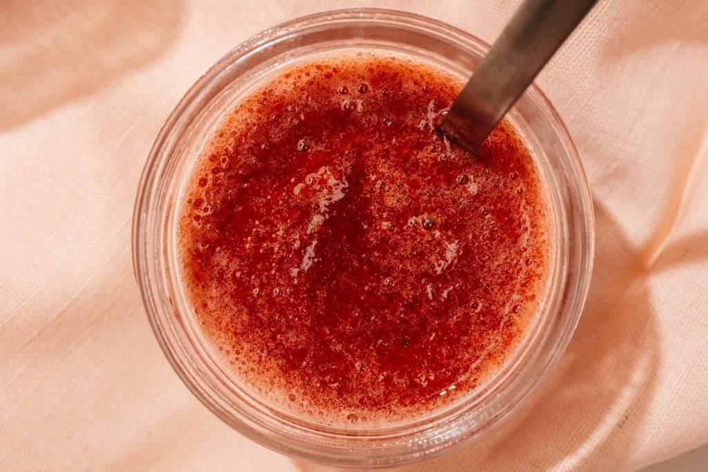 strawberry jam in a glass jar close up