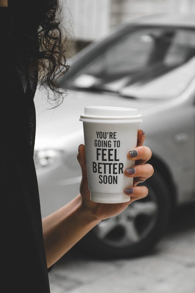 woman holding a cup of coffee