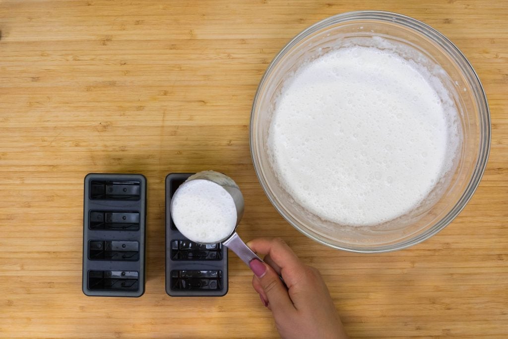 keto ice cream bars Pouring the mixture into popsicle molds