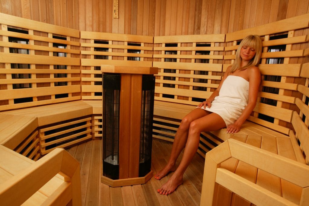 infrared sauna benefits woman enjoying infrared sauna