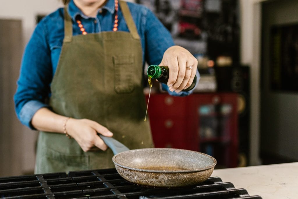 woman frying with oil