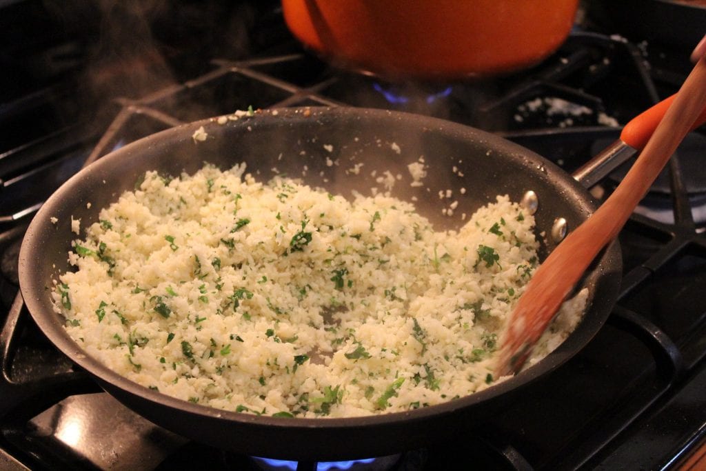 cooking cauliflower rice on the stove