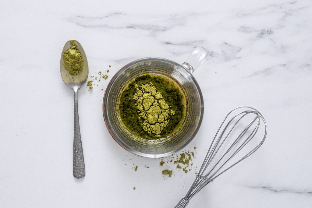 mixing matcha powder with water