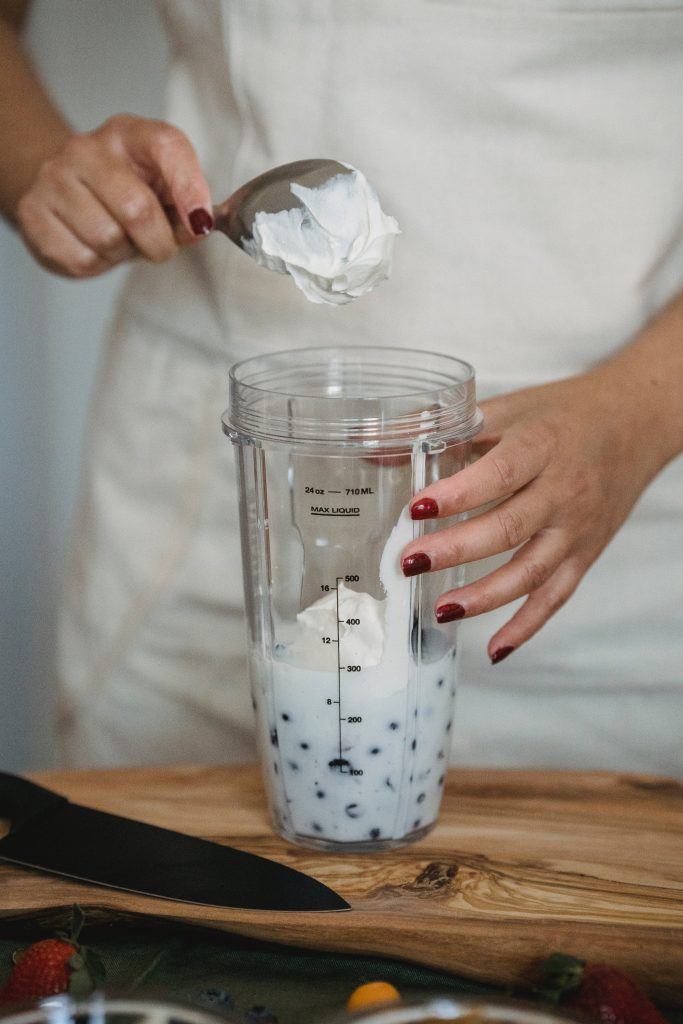 woman cooking with sour cream